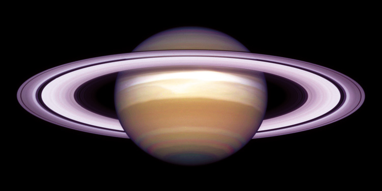 Figure 8. Saturn in October 1998. Saturn's equator is tilted relative to its orbit by 27°, very similar to the 23.5° tilt of the Earth. This image shows Saturn during its winter solstice when the North Pole is tilted away from the Sun.  (Image Source: Hubble Space Telescope).
