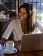 Woman using a laptop in a cafe
