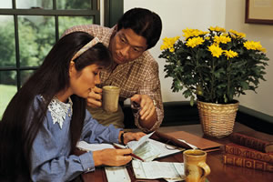 man and woman reviewing a credit report