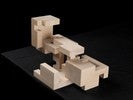 Photograph of bass wood cube model with shifted portions of the cube.