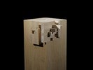 Photograph of bass wood cube model on base with shifted portions of the cube.