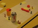 Now the board features pink and blue toy soldiers; some share a space, one is on top of the Play-Doh tub, and another hides behind the Coke can.