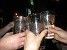 Photo of students raising their glasses in a toast to Galileo.