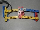 A standard Lego claw run by a pneumatic pump sensor.