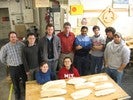 The instructors and class with all of their completed half-hull models.