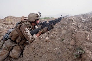 A U.S. Marine in Afghanistan looking for insurgents.