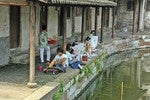 Artists painting along the canal.