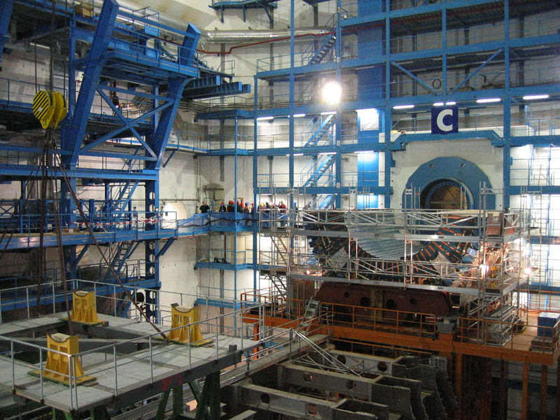 ATLAS experiment detector under construction in October 2004 in its experimental pit; the current status of construction can be seen on the CERN website.[1] Note the people in the background, for comparison. Nikolai Schwerg CC BY-SA 3.0