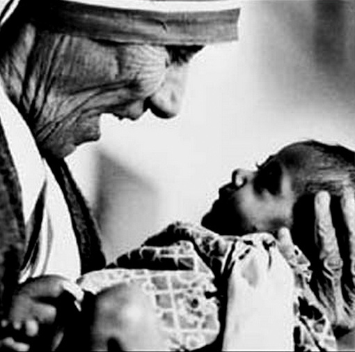 Mother Teresa holding a newborn baby