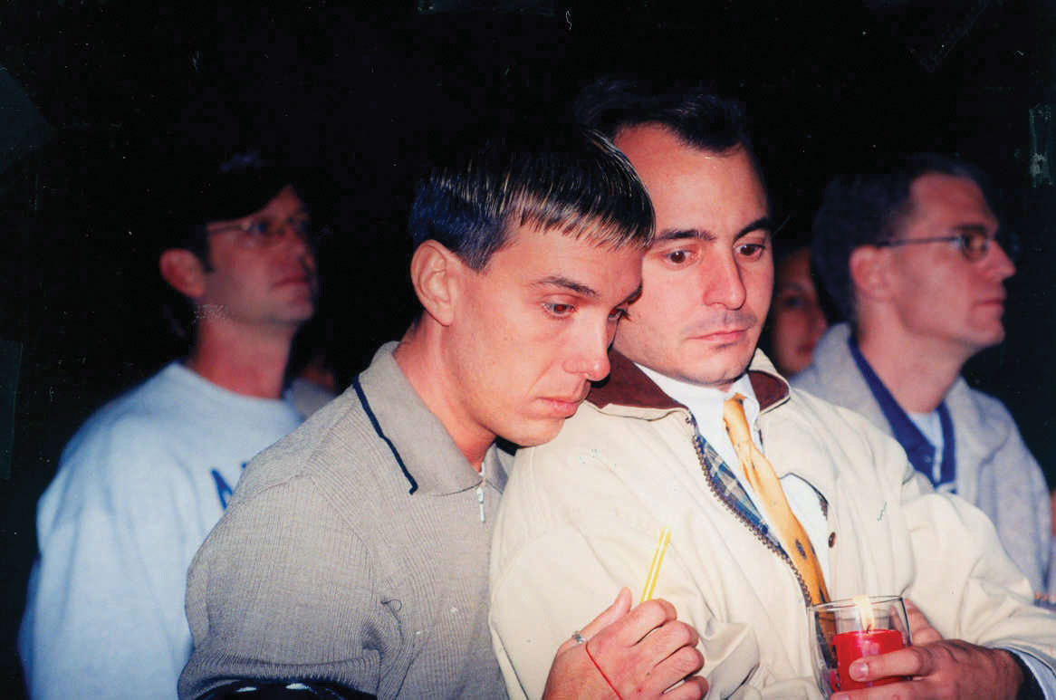 Photo of participants in a candlelight vigil in memory of Mathew Shepard.