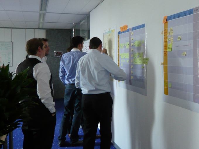 Group of men at a whiteboard