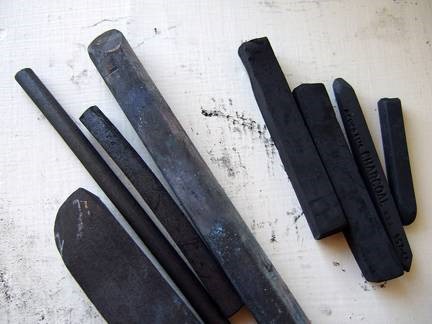 Left: vine charcoal sticks. Right: compressed charcoal squares.